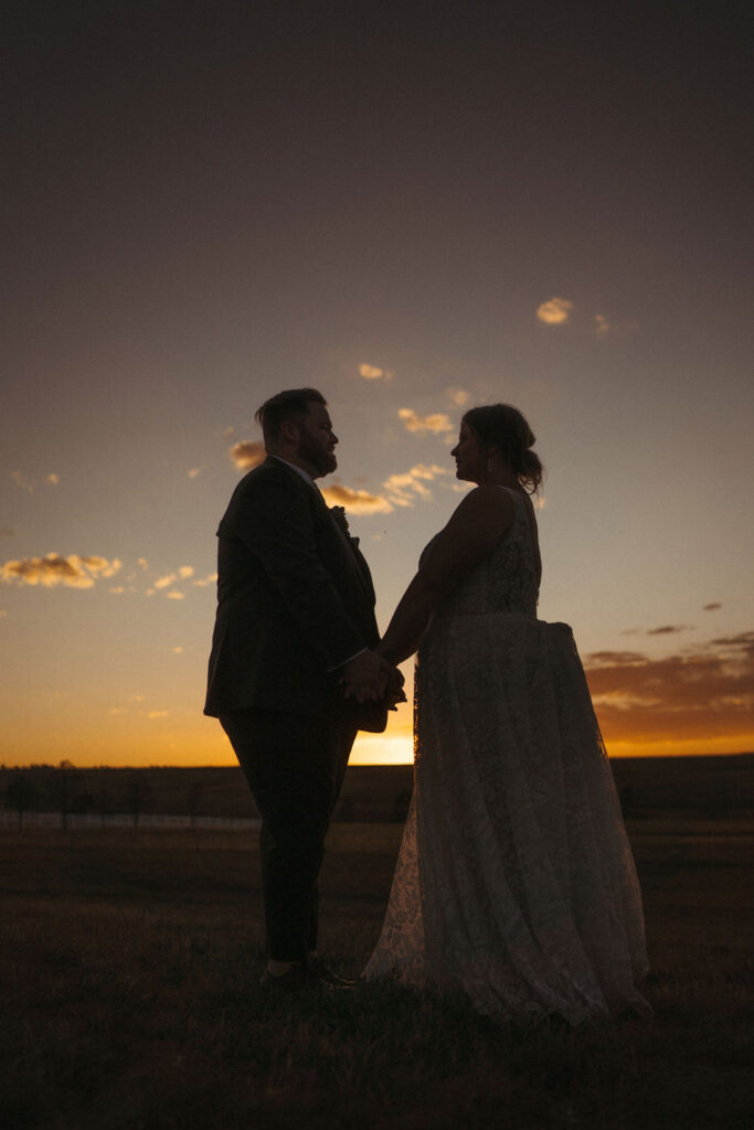 Magical Colorado sunset bridal portraits at Flying Horse Ranch photographed by Wilder Photography