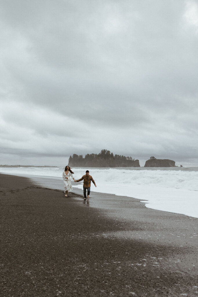 Moody engagement photos on Rialto Beach in Olympic National Park