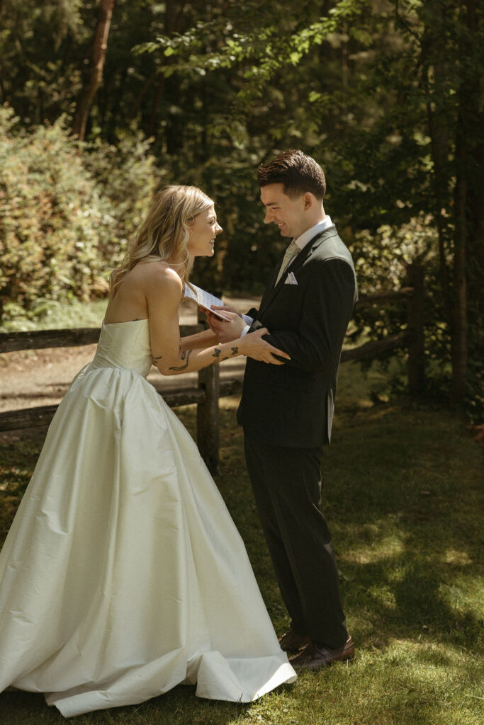 Bride and groom exchange private vows during a beautiful backyard wedding